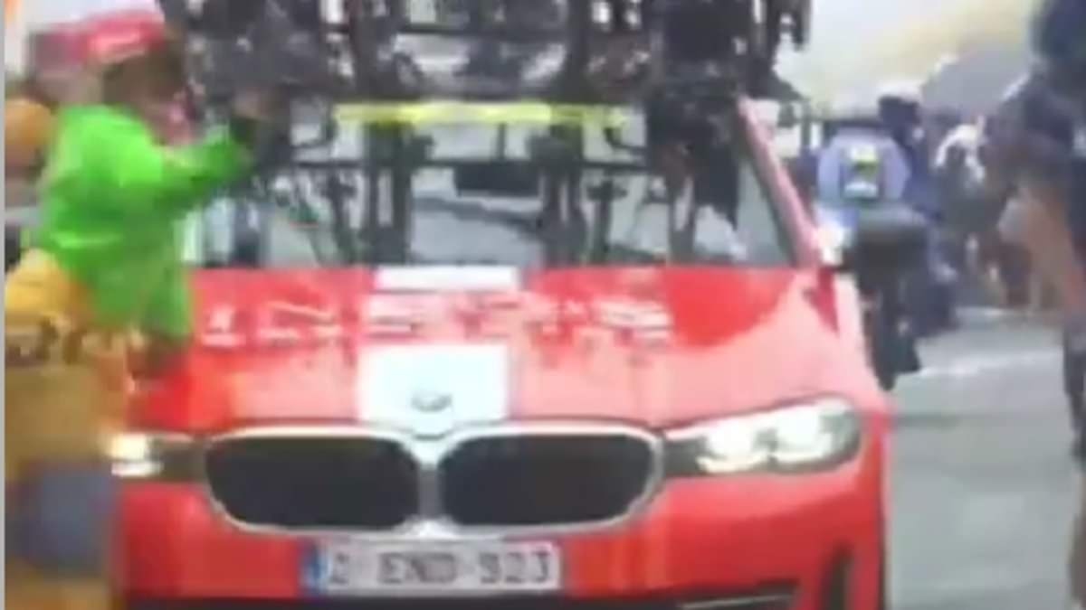 INEOS' team car knocks down SPECTATOR on the road during Tour de France mountain climb - in horror moment involving Man United co-owners