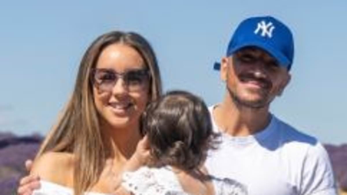 Peter Andre's wife Emily shares sweet snaps with singer and their daughter Arabella, one, in matching white ensembles during family day out to purple flower field