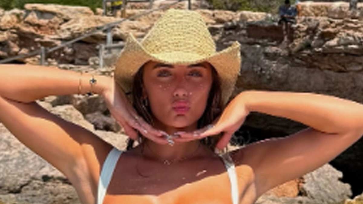 Love Island winner Millie Court sends temperatures soaring in a skimpy black bikini during a sun-soaked holiday in Ibiza