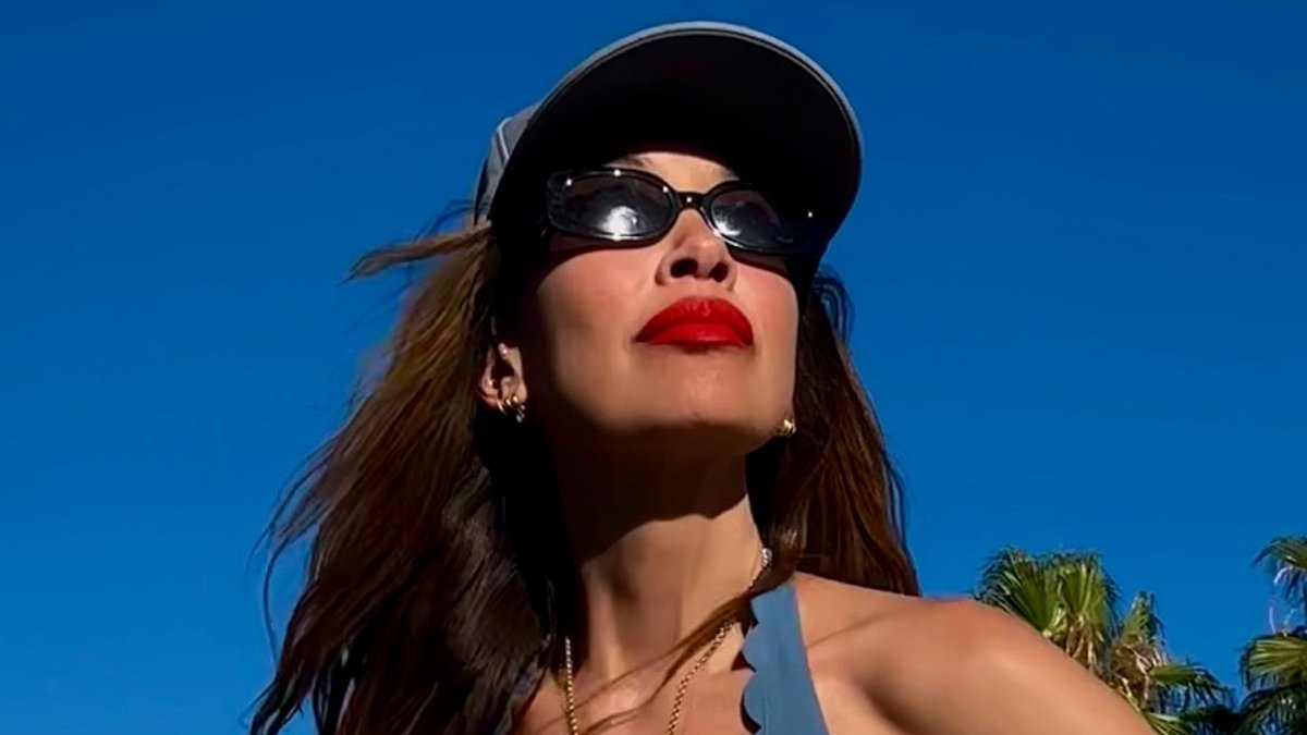 Myleene Klass, 47, shows off her incredible physique in a skimpy blue bikini as she poses up a storm in sizzling new snaps