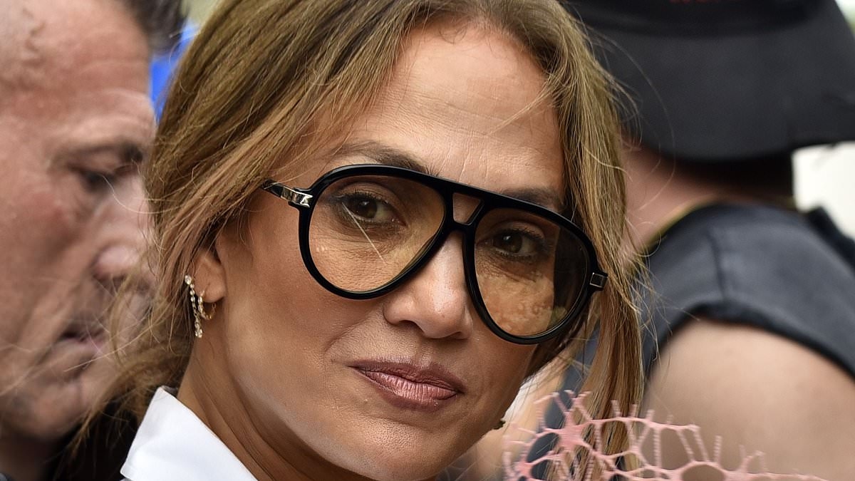 Jennifer Lopez, 55, gets gifted flowers by fans as she steps out in Pisa amid Up All Night tour
