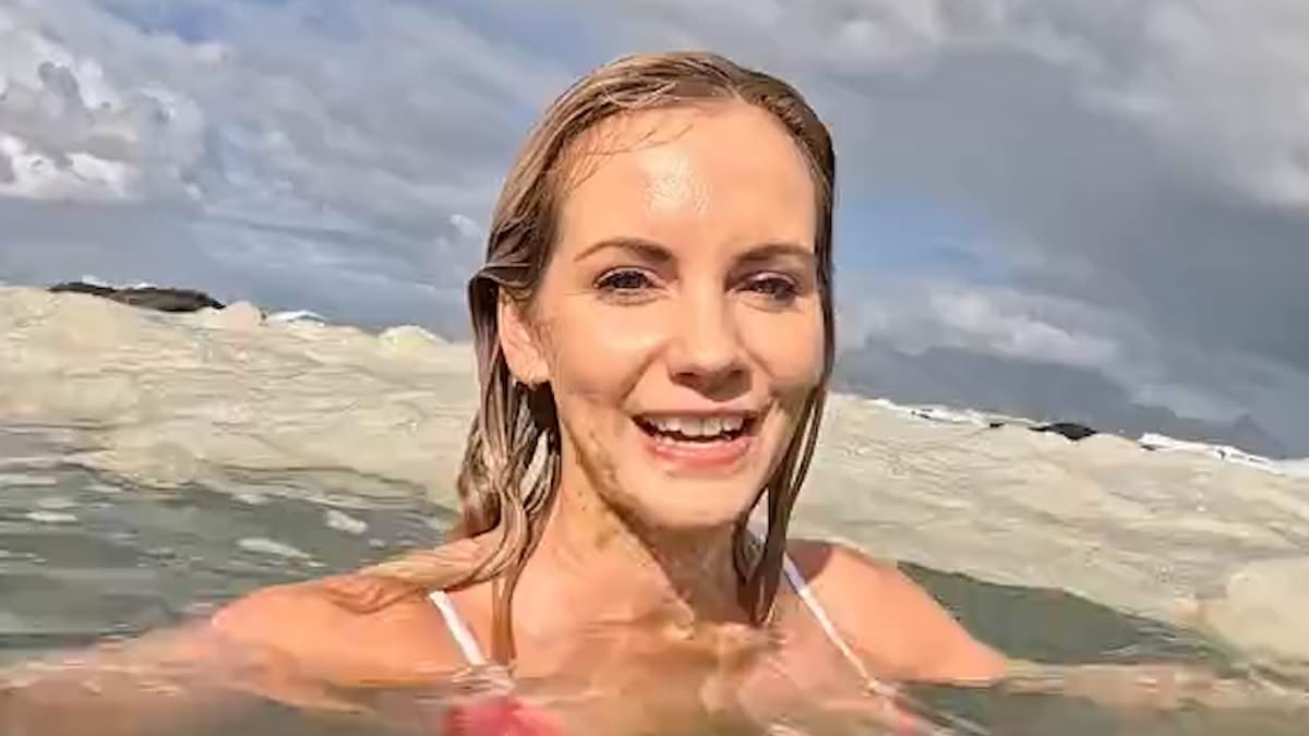 Influencer divides opinion with video swimming in murky-looking sea foam after claiming there had been a raw sewage spillage