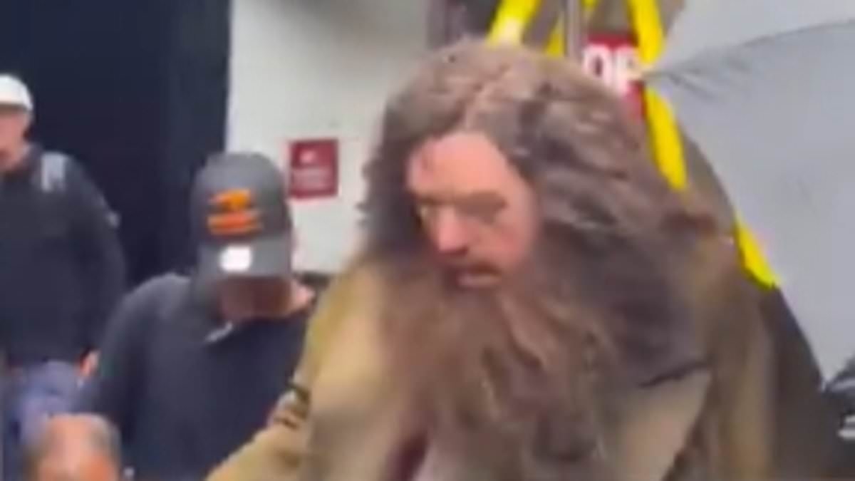 First look at Nick Frost as Hagrid on set of Harry Potter TV series as he strides past fast food restaurants to get the tube - and fans are already divided