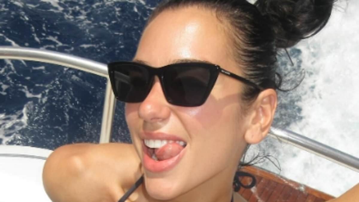 Dua Lipa sends temperatures soaring in a skimpy black bikini in slew of snaps from romantic getaway with fiancé Callum Turner
