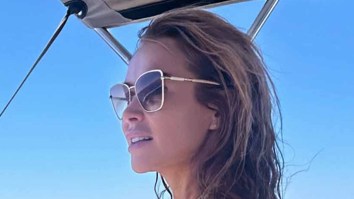 Amanda Holden, 54, sizzles in a yellow string bikini while on a lavish boat during family getaway in Greece