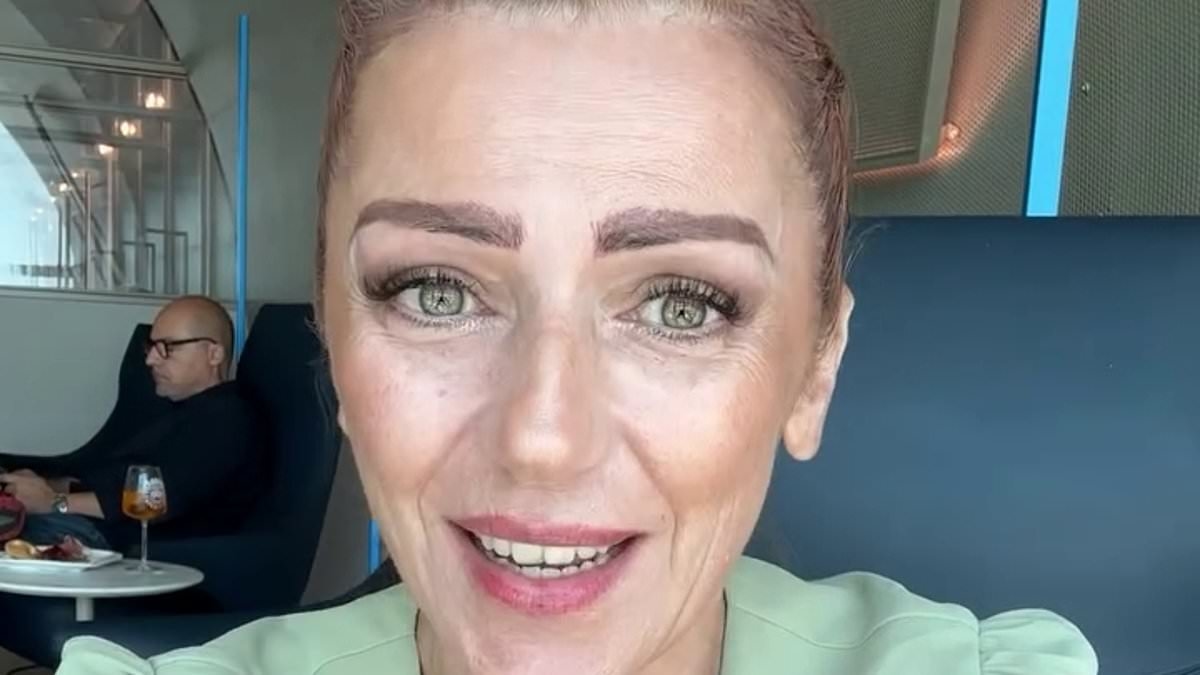 Glamorous Italian nuclear physicist hits back at sexist trolls after being bombarded with abuse for posting video of herself in low-cut dress