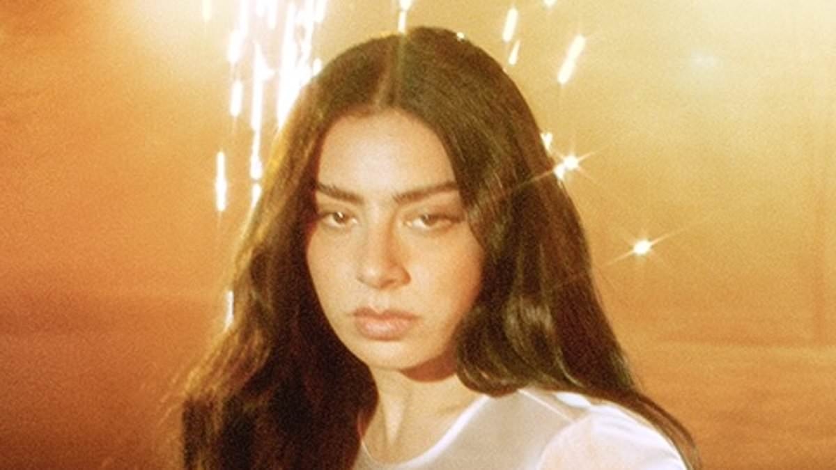 Charli XCX kicks off married life with a racy new promotional campaign as she launches her very own range of Converse footwear... days after exchanging vows with George Daniel