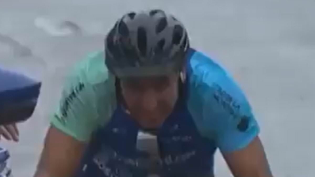 Amateur prankster's dangerous bid to 'win' Tour de France stage ends VERY painfully - courtesy of a security guard