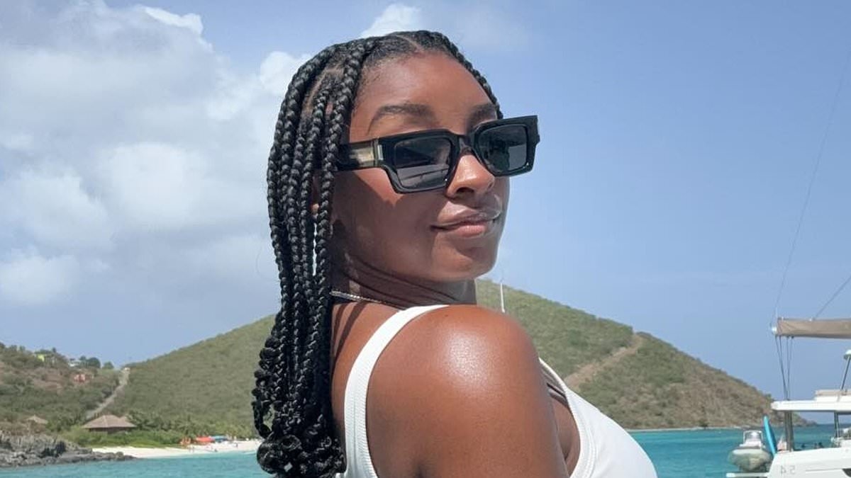 Simone Biles flaunts her derriere in tiny thong bikini... but covers chest amid boob job rumors