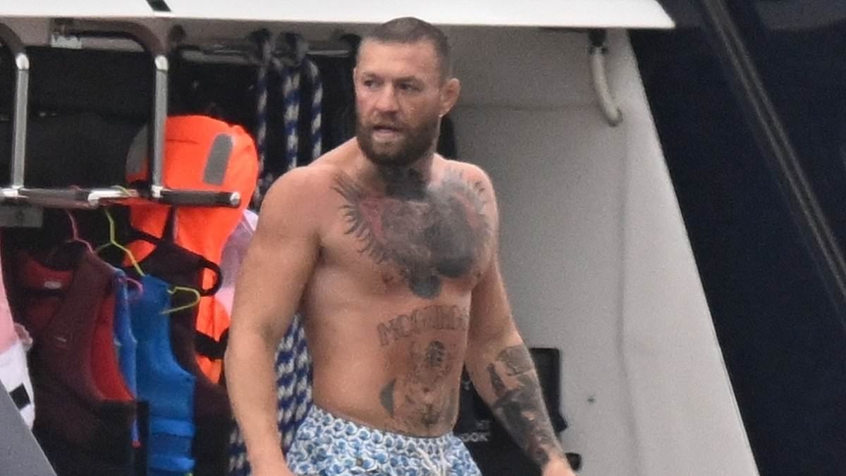 Conor McGregor is blissfully unaware of Dublin pub fire as he spends quality time with his family on yacht holiday just hours before £2million boozer went up in flames
