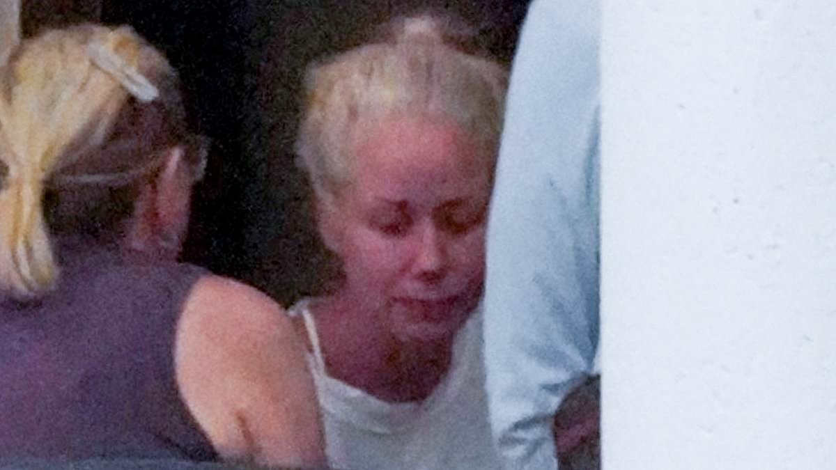 Hulk Hogan's heartbroken widow tearfully embraces loved ones as she is seen for the first time since WWE icon's fatal cardiac arrest