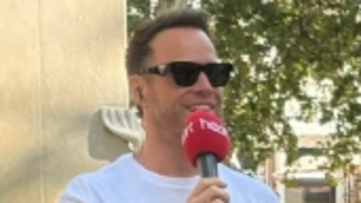 Olly Murs puts on a VERY cheeky display as he strips off to his underwear in London's Leicester Square for hilarious stunt