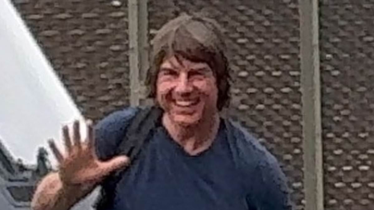 Tom Cruise, 63, grins and waves as he lands in London on his helicopter with his 'new love' Ana de Armas, 37, and her beloved dogs