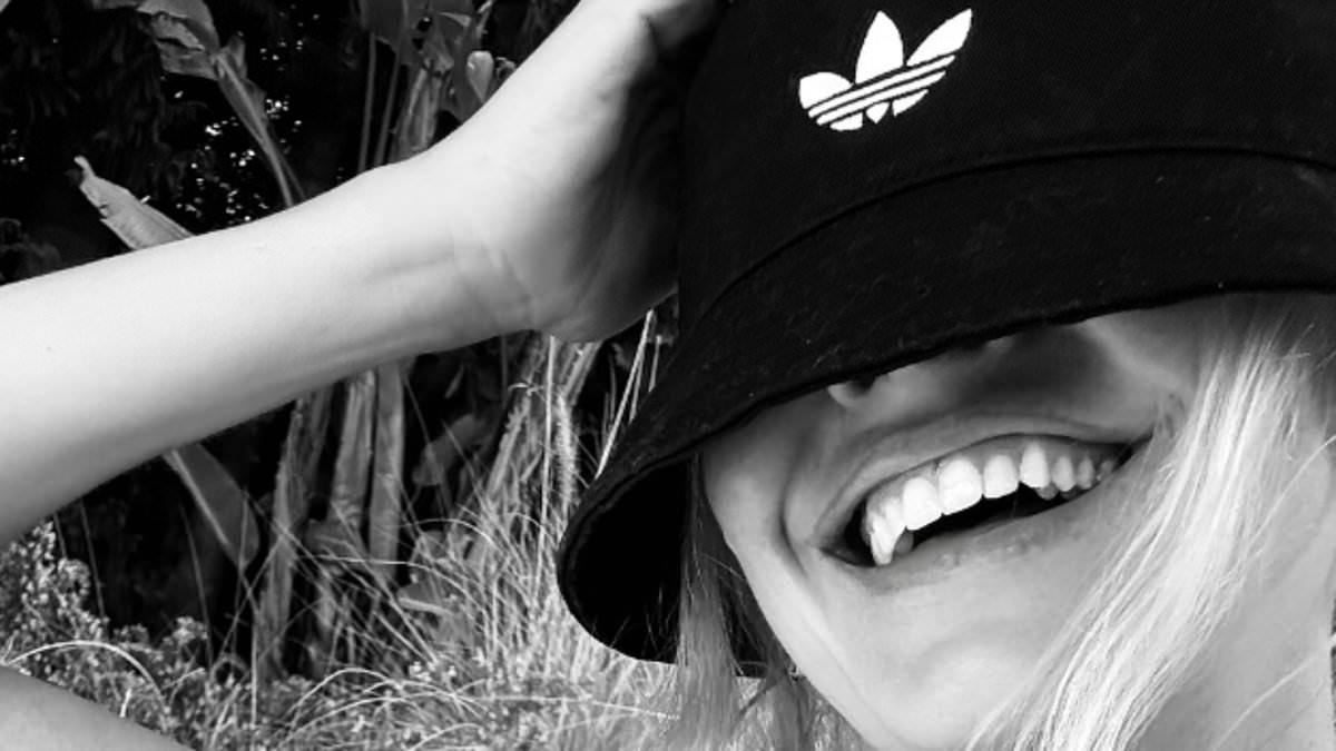 Holly Willoughby shows off her incredible figure in a rare bikini selfie as she shows her support for Oasis ahead of their second Wembley gig