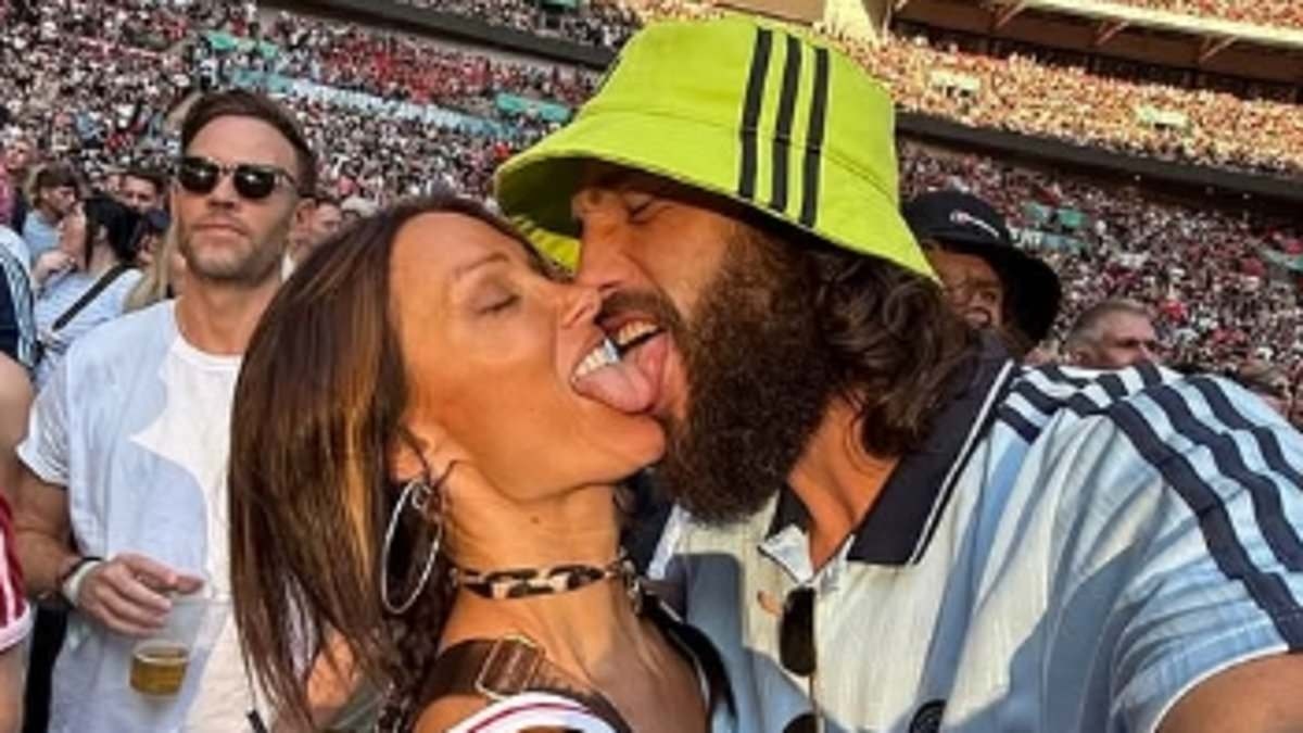 Lou Teasdale and Andy Carroll maintain their united front after 'Greek bust up' with another steamy public display of affection at Oasis gig - as Geordie striker admits it's 'not the first time I've scored at Wembley'
