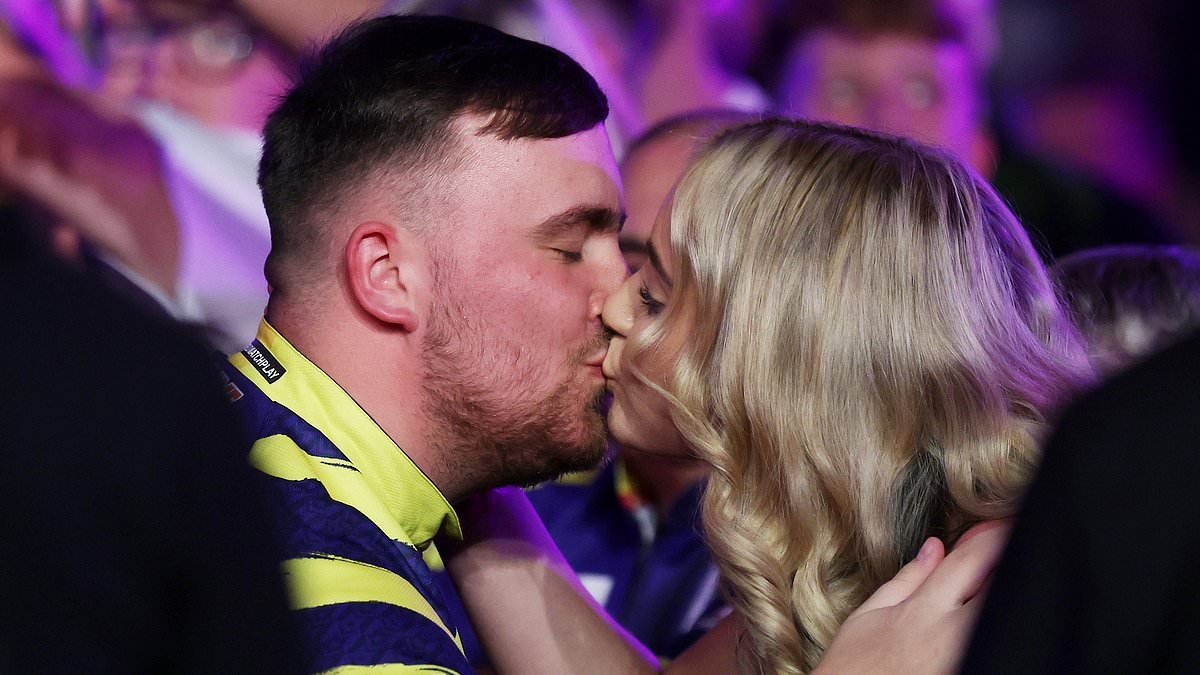 Luke Littler celebrates making darts history - and £200k payday - on stage with his girlfriend... after confirming relationship with subtle gesture on live TV