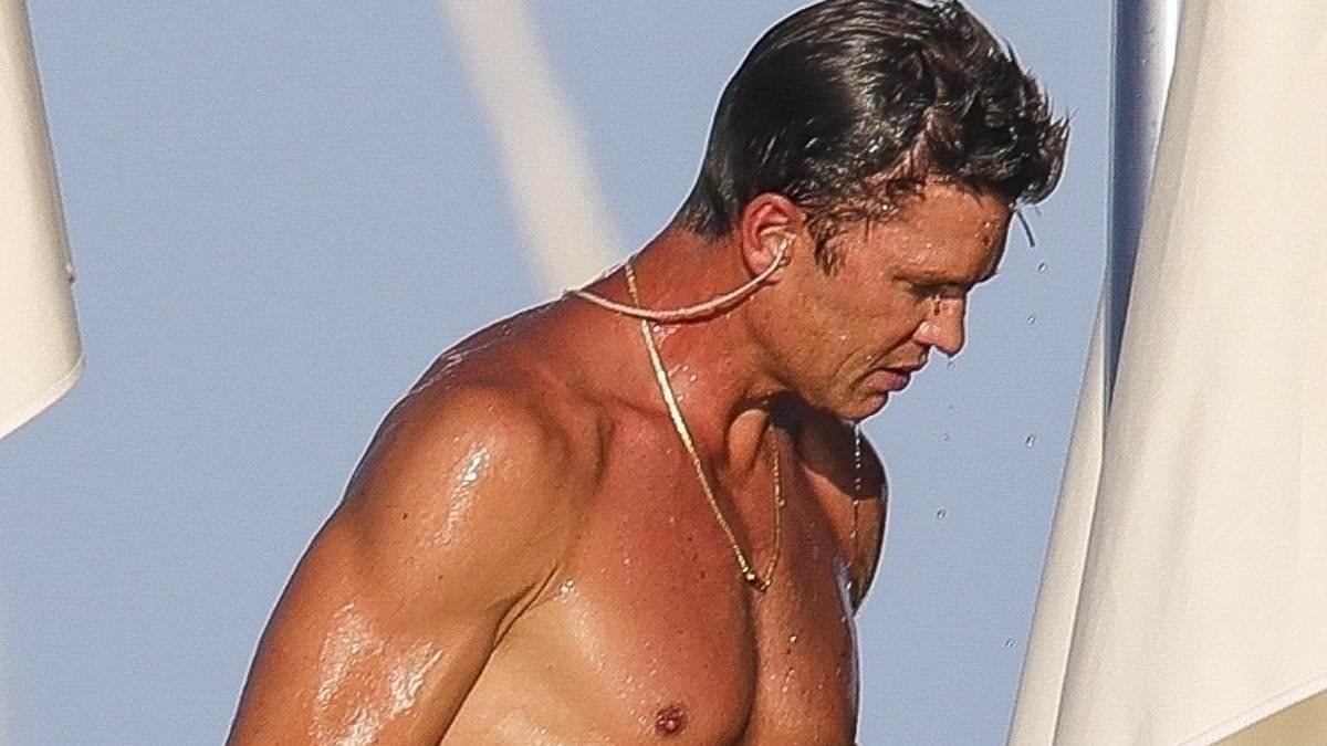 Shirtless Tom Brady shows off ripped physique on yacht in Ibiza as NFL legend, 47, enjoys offseason vacation
