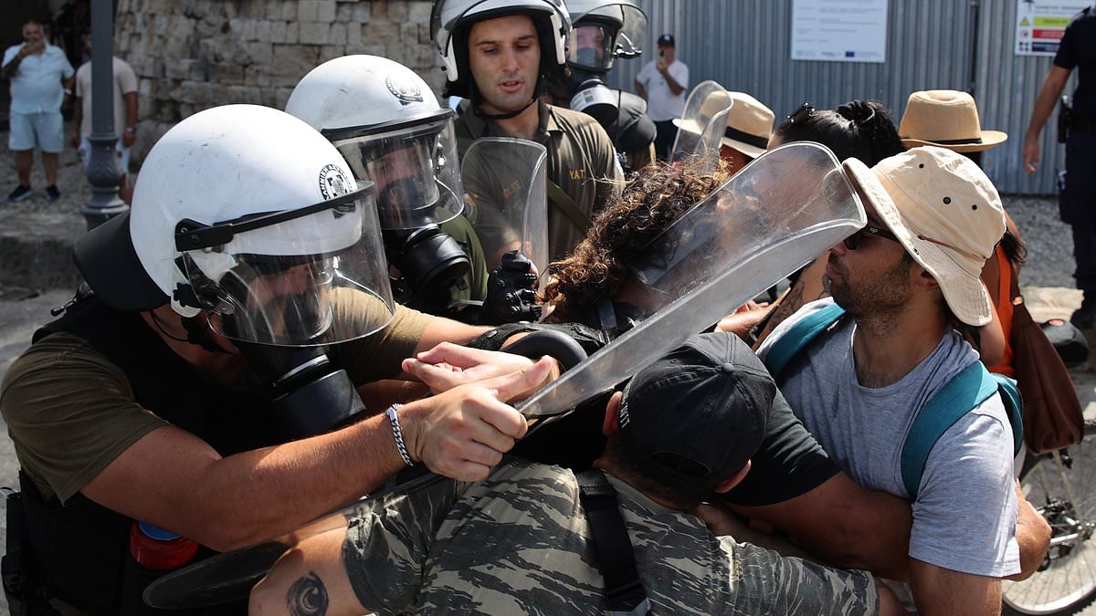 Greek riot cops clash with pro-Palestine supporters as Israeli cruise ship docks in Rhodes - days after protesters blocked its passengers from disembarking on another island