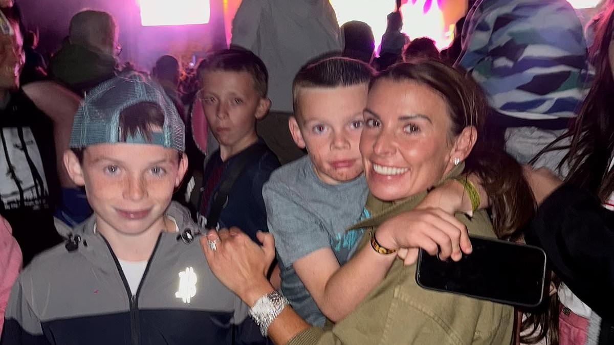 Coleen Rooney has the time of her life as she lifts son Cass, six, on to her shoulders at Together Again Festival