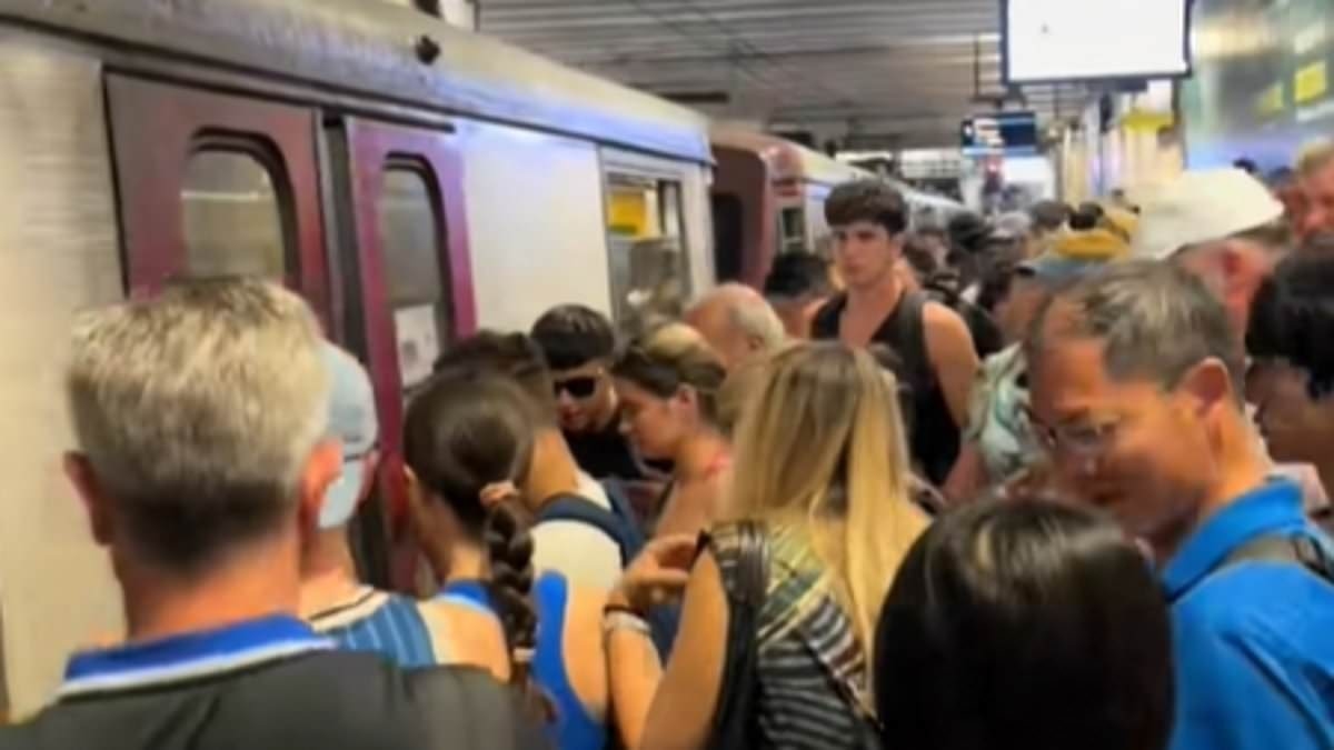 The great Amalfi Coast divide: Videos show tourists crammed onto buses and inching down streets in Italian holiday hotspot... while the rich and famous dodge crowds on superyachts