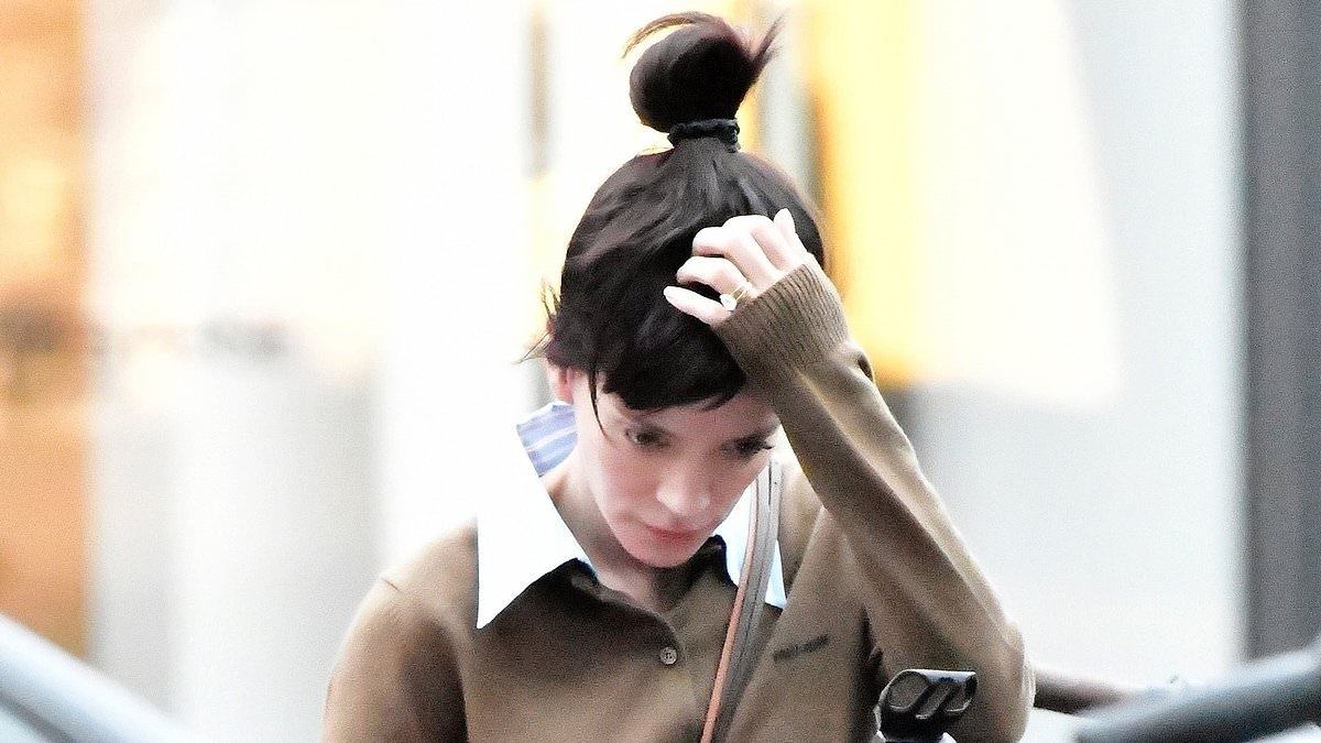 Lily Allen sports a diamond band on her ring finger as she enjoys bike ride in Notting Hill