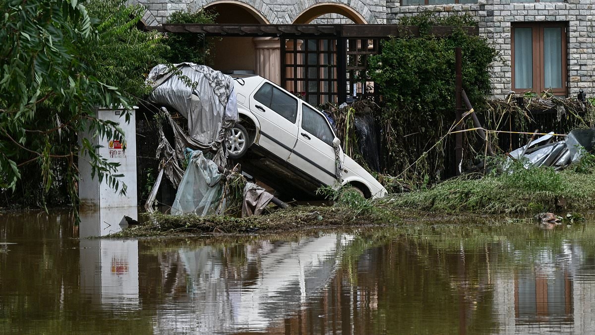Dozens killed and tens of thousands evacuated as China is hit by 'once in 100 years' flooding