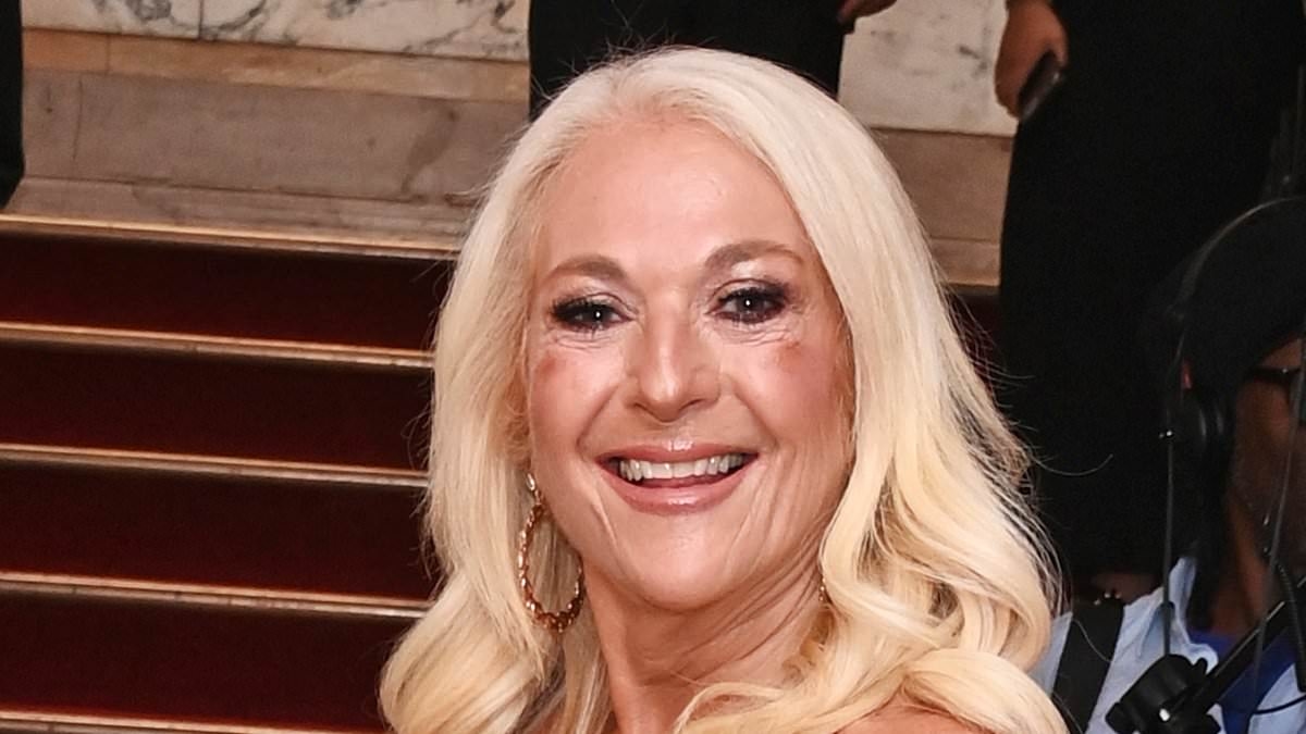 Vanessa Feltz dazzles in a dusky pink beaded gown as she is awarded the Talk Show gong at the National Reality TV Awards