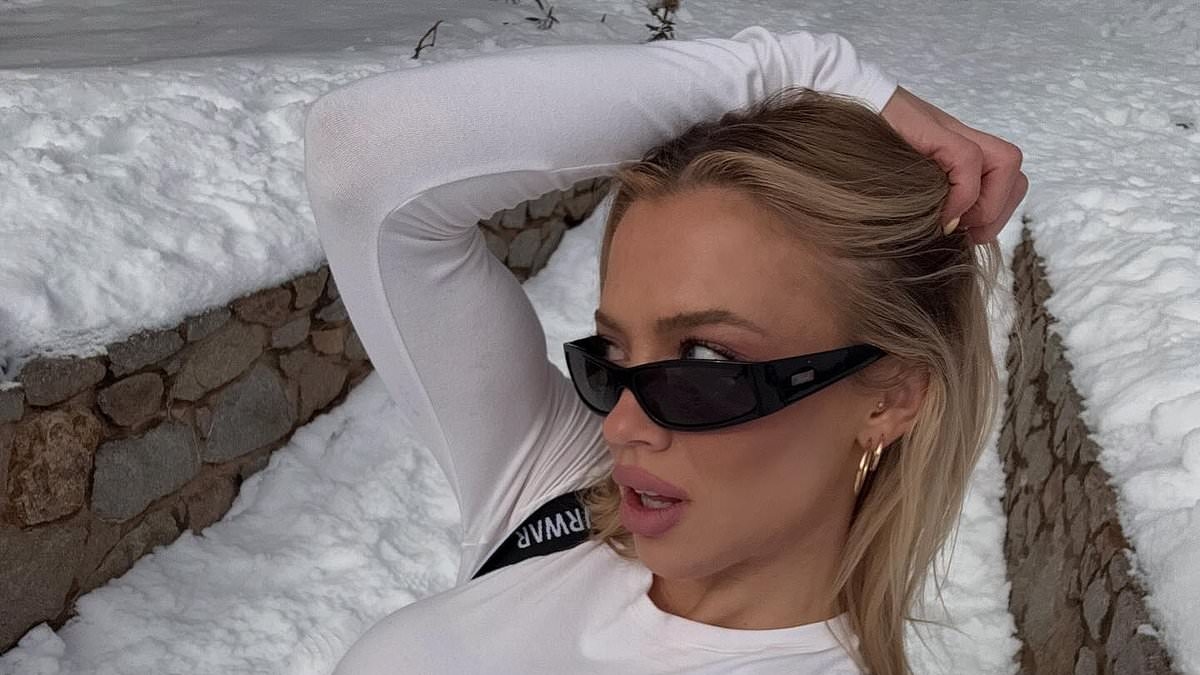 Tammy Hembrow suffers MAJOR wardrobe malfunction as she goes braless under see-through snowboarding ensemble