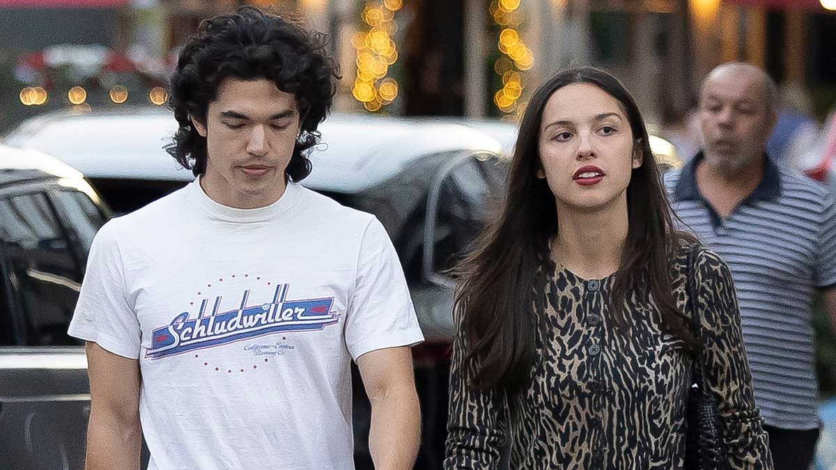 Olivia Rodrigo cuts a chic figure in an leopard print cardigan and mini skirt as she steps out with close pal Conan Gray in London's Notting Hill