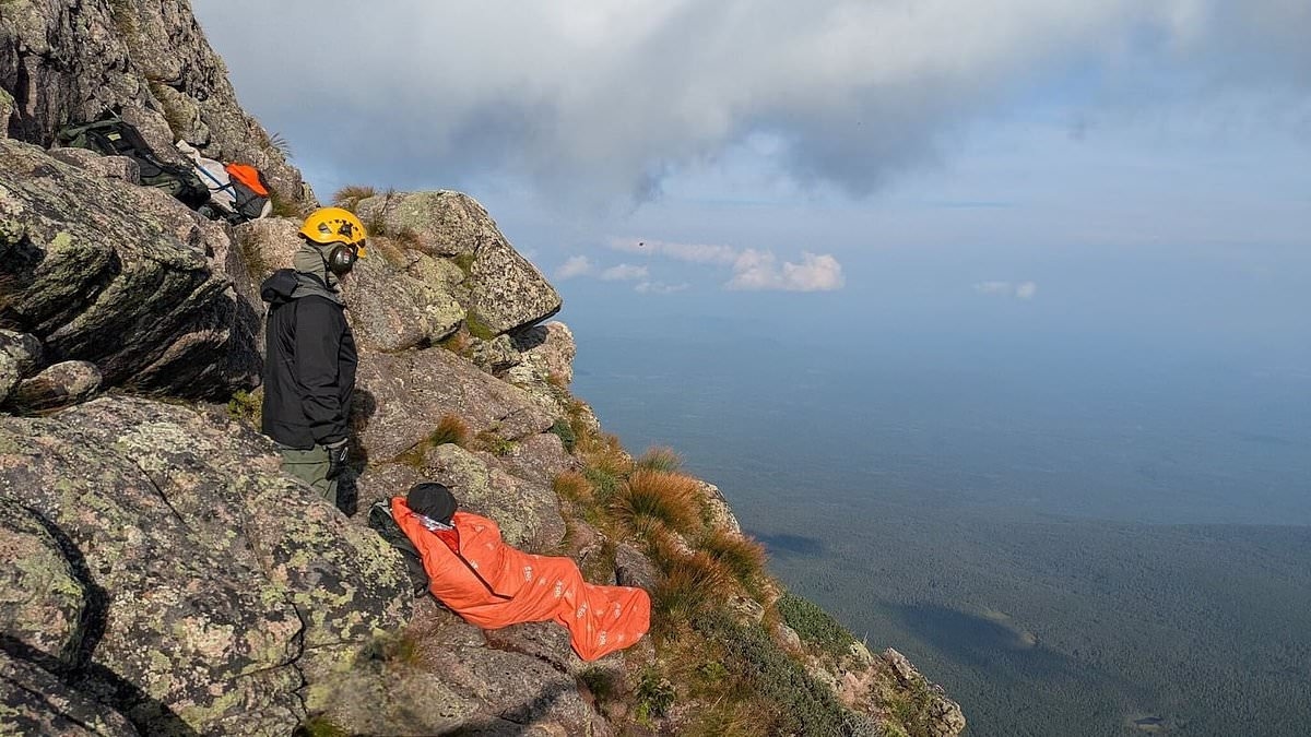 Hikers' hellish night atop notorious mountain that saw them stuck on stony ledge that grew slippery as rain began to fall
