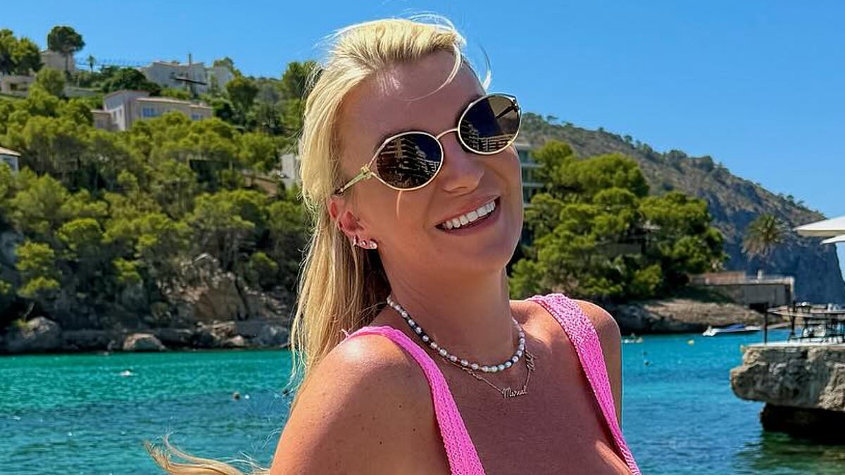Billi Mucklow shows ex Andy Carroll what he's missing as she poses in a pink Hunza G bikini during Spanish getaway