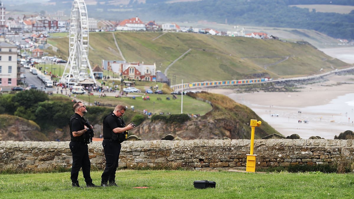 Man and woman 'jumped' 200ft to their deaths from cliff in front of horrified onlookers at seaside beauty spot