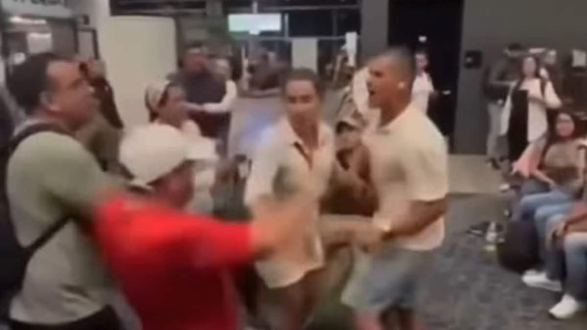 Brawl erupts in airport after man slapped woman for refusing to get up from seat next to his wife
