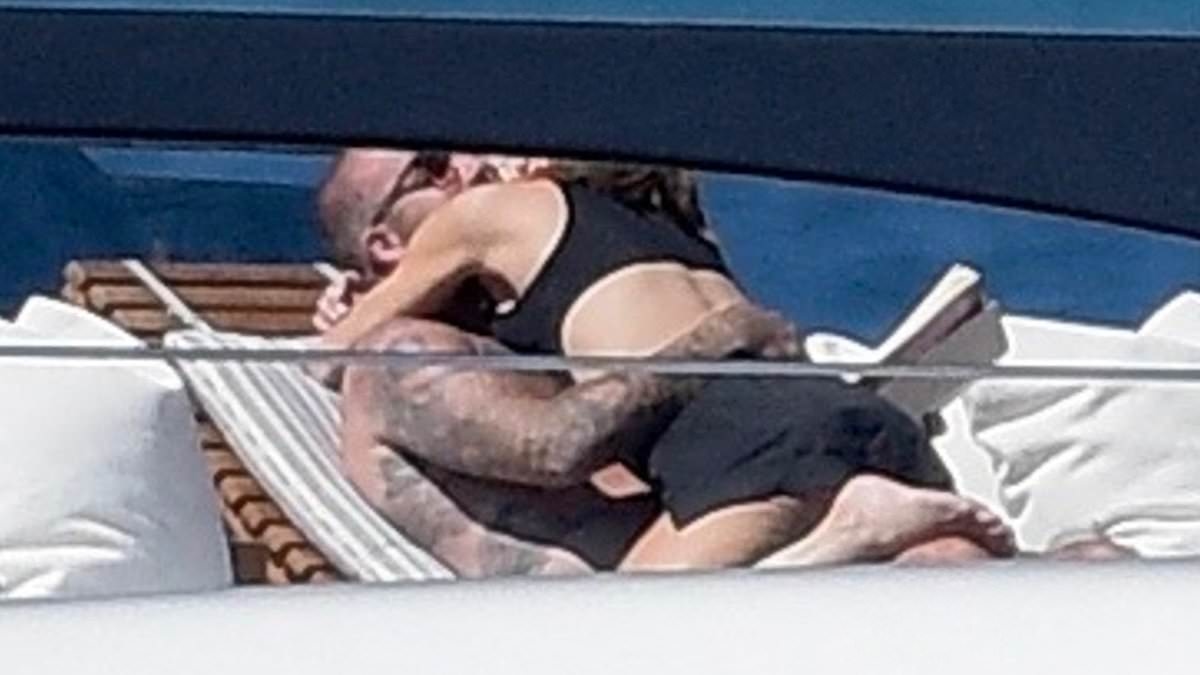 Victoria Beckham straddles shirtless husband David before he cools off in the shower as besotted pair share very steamy moment on their £16M yacht