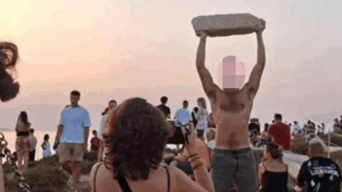Outrage in Greece as ‘disrespectful' tourist lifts up ancient marble to pose for photos at famed island temple