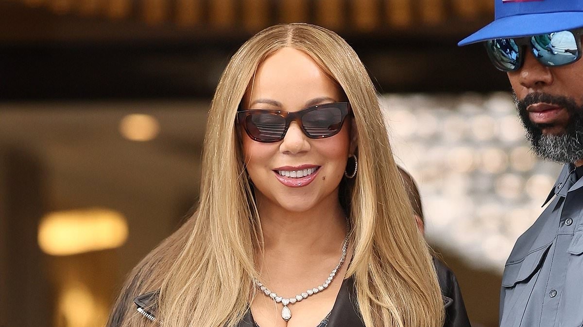Mariah Carey puts on a leggy display in a denim mini dress as she steps out in London ahead of her Brighton Pride performance