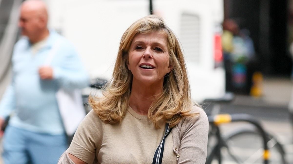 Kate Garraway puts on a brave face and heads out in a quirky outfit after being forced to sell £2 million home to pay off debt