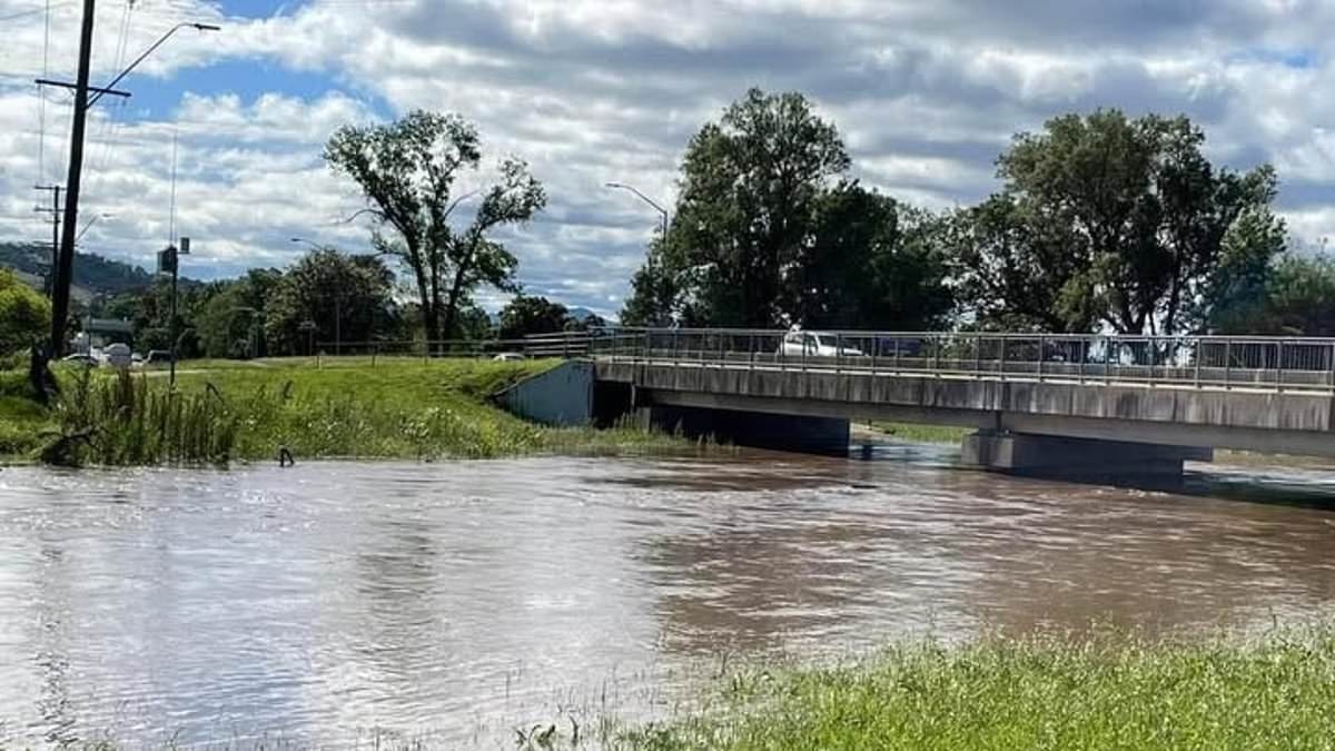 Desperate search is launched for missing woman after she was swept away in floodwaters while in a car