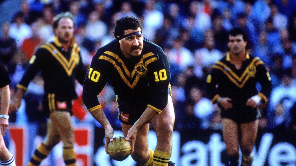 Sam Backo dead at 64: Tributes are paid to footy great after he tragically passes away weeks after stay in hospital battling life-threatening tropical disease