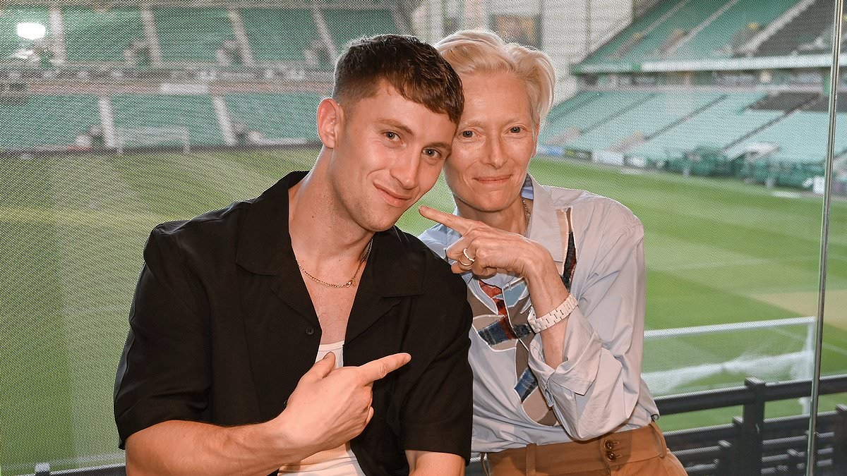 Tilda Swinton looks chic in smart high-slung trousers as they join Alfie Cain at Hibernian's Easter Road stadium for powerful Edinburgh Fringe play on mental health in football