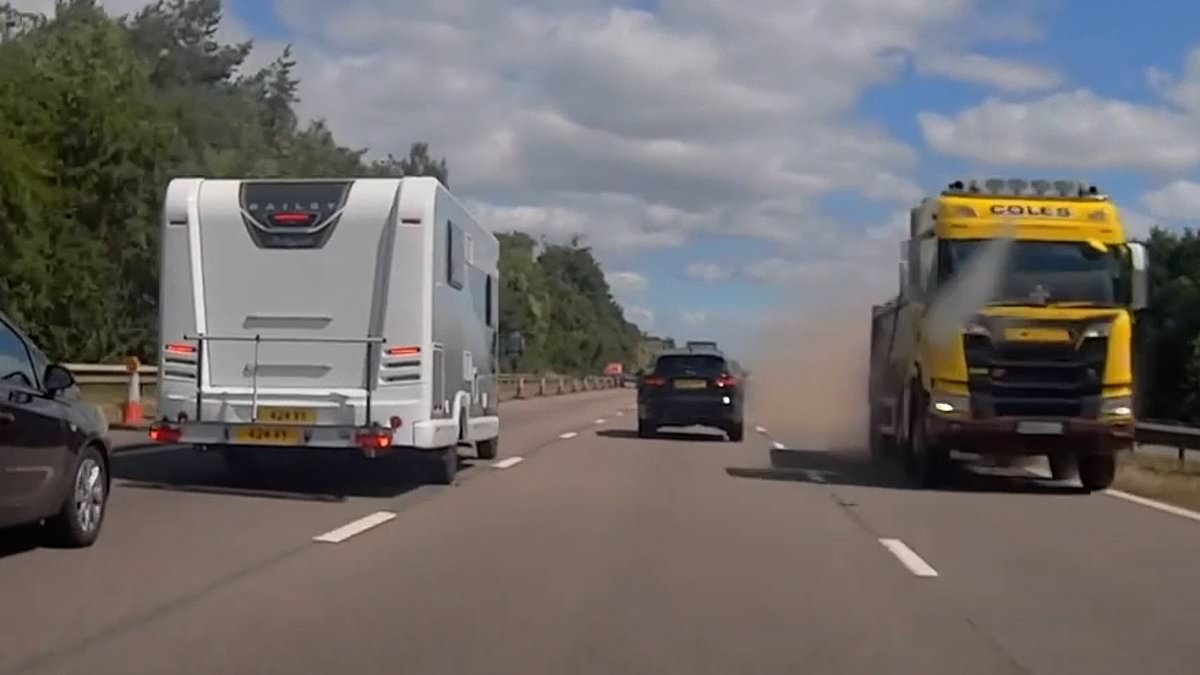 Terrifying moment lorry crashes through central reservation and towards incoming traffic on motorway