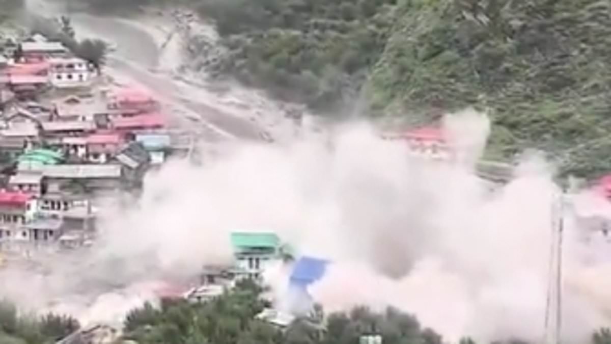 Terrifying moment village is washed away by cloudburst flash flood in India, killing multiple people and leaving dozens trapped