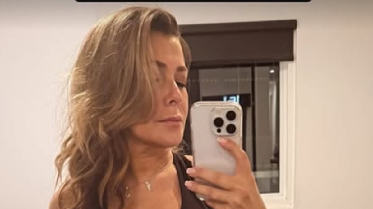 Kym Marsh, 49, seemingly hits back at resurfaced Hear'Say 'fat-shaming' clip as she flashes her abs in a black sports bra while posing for a sizzling mirror selfie