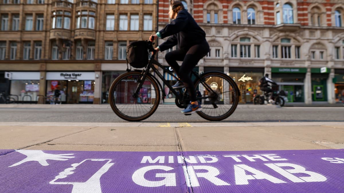 What a joke! Fury on Oxford Street after purple STICKER telling shoppers to beware of phone snatchers appears... as Brits call for more police
