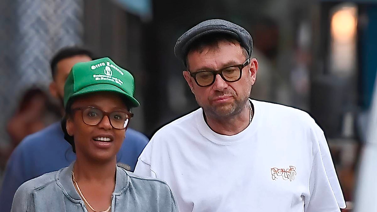 Damon Albarn heads out for a stroll with a new female companion as they stock up on snacks together - and she's the spitting image of his ex Suzi Winstanley