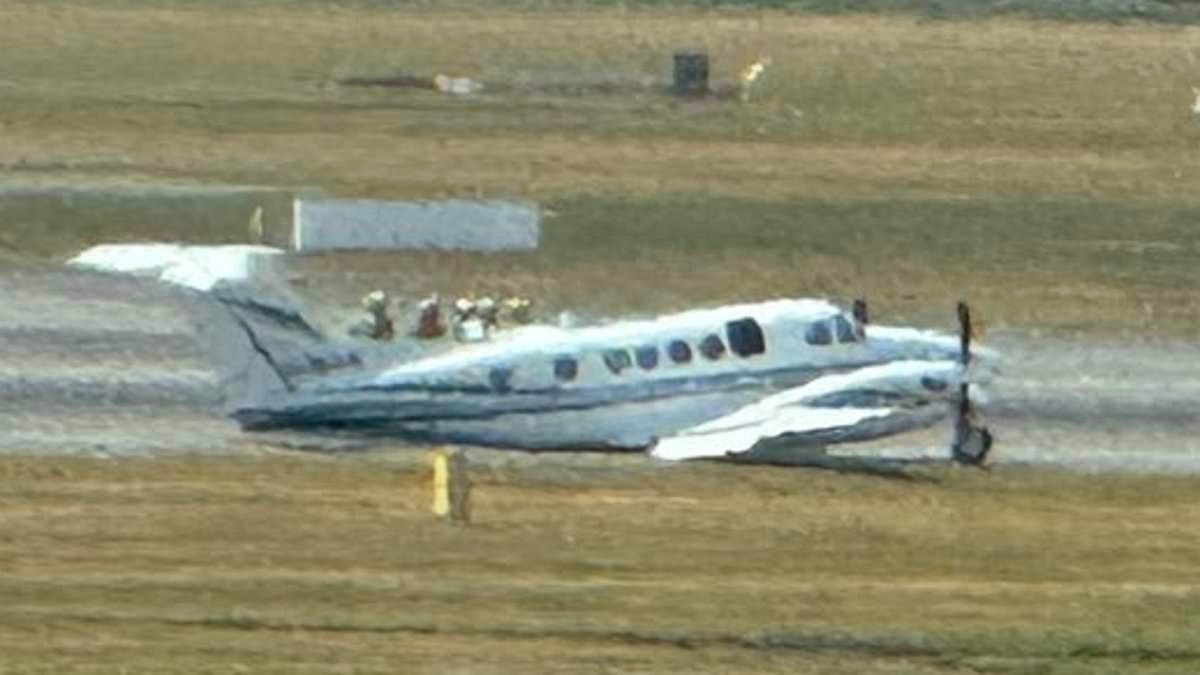Moment private plane makes emergency landing at Birmingham Airport: Travel chaos for holidaymakers as all flights remain grounded