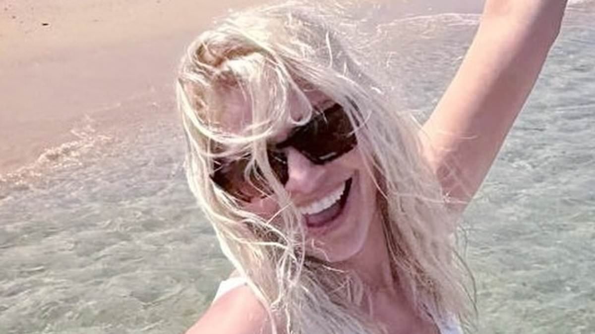 Holly Willoughby wows in a white swimsuit as she lives it up on the beach during sun-soaked Portuguese holiday with sister Kelly