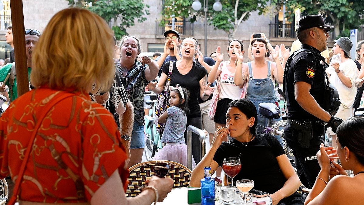 Karma's a beach! 'Irresponsible' anti-tourism protesters are slammed by Spanish beach bars after their 'negative' messages see HUGE slump in trade