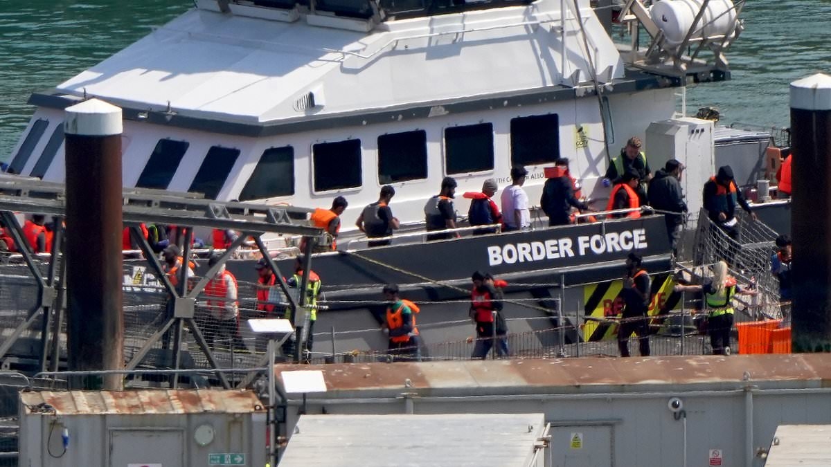 First small boat migrants are detained for removal to France under new 'one-in, one-out' scheme after arriving in Dover yesterday