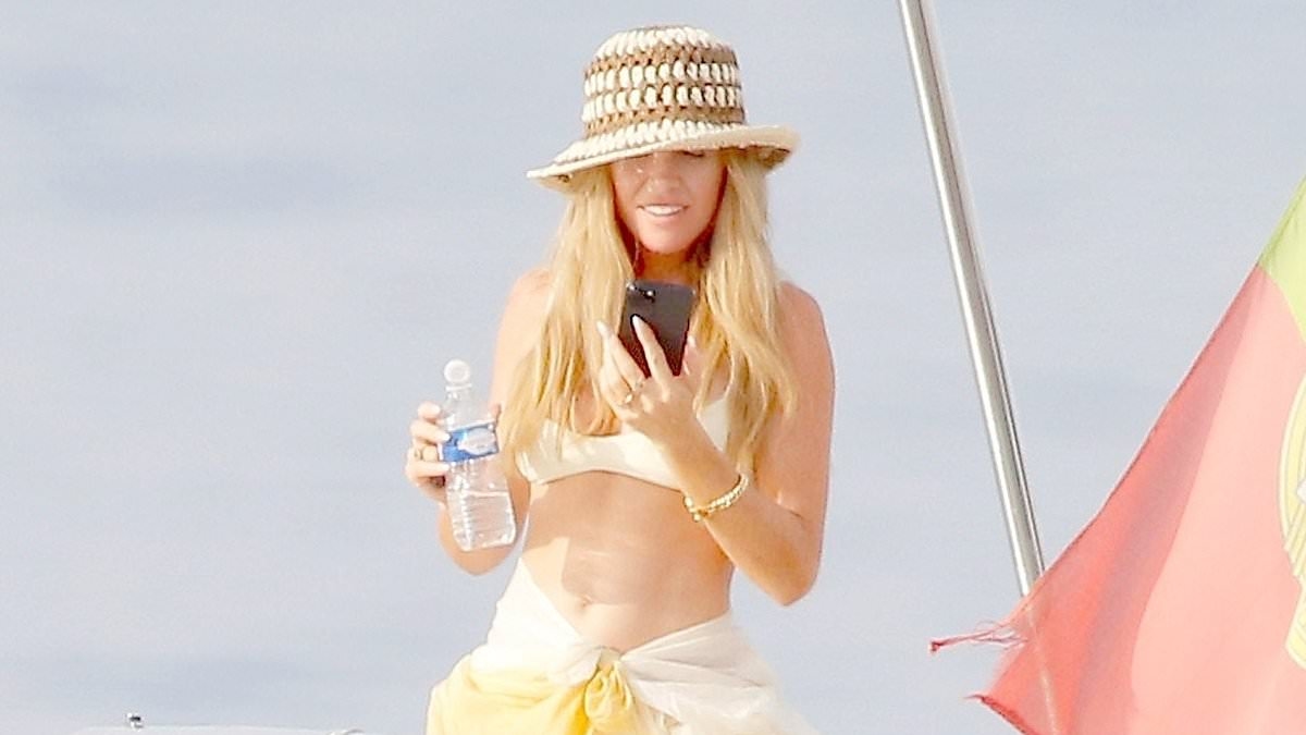 Abbey Clancy looks sensational in a tiny cream bikini as she enjoys a yacht trip with shirtless husband Peter Crouch in the south of France